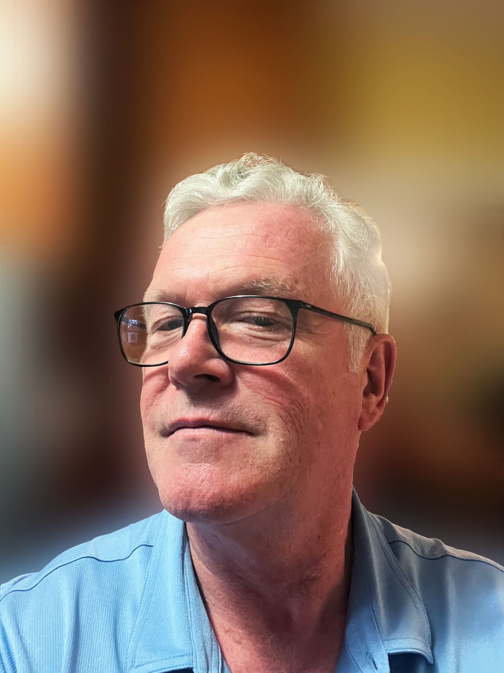 Portrait photo of Dr. David Power with a blurry background.